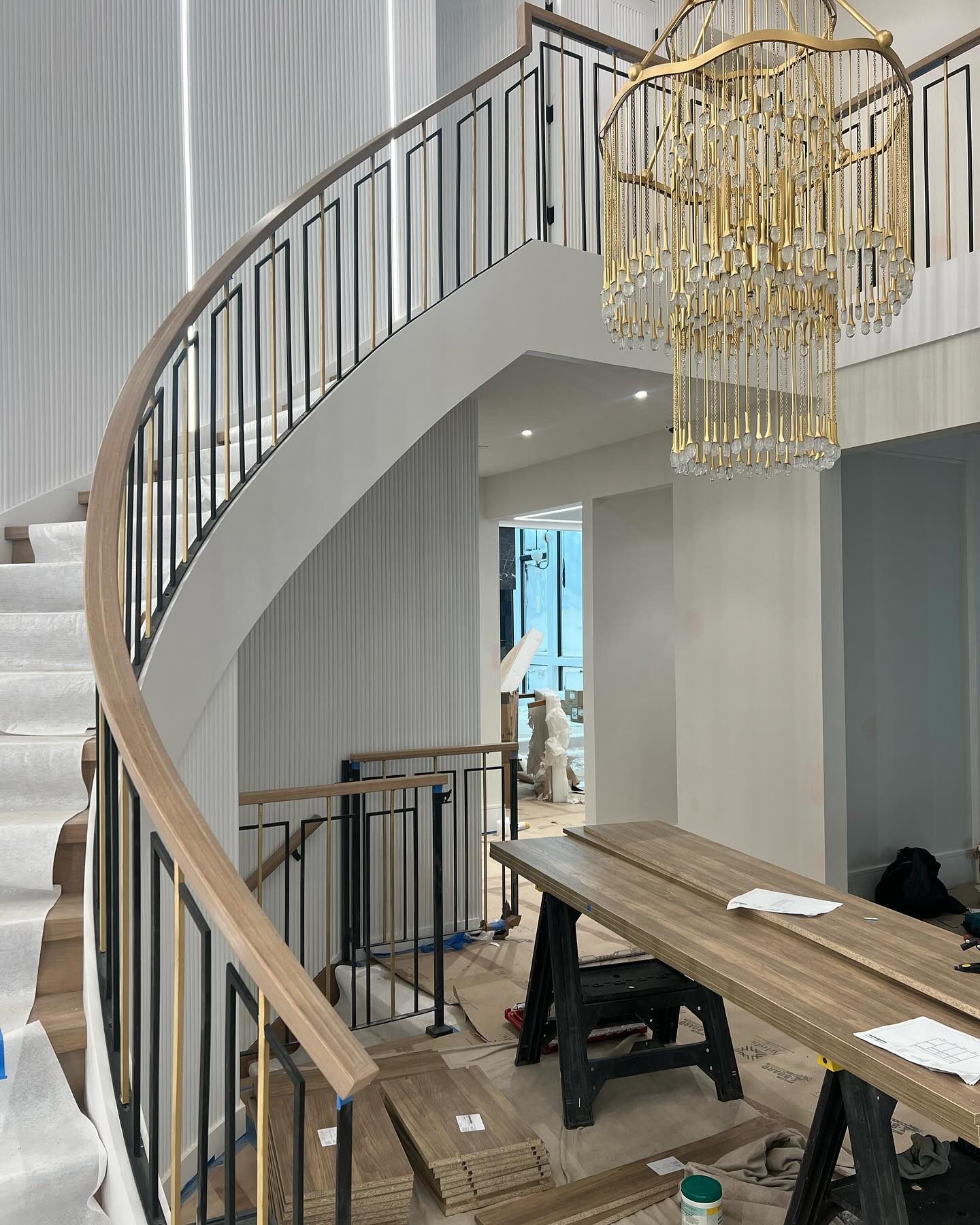 Curved interior stair railing by Ballabani